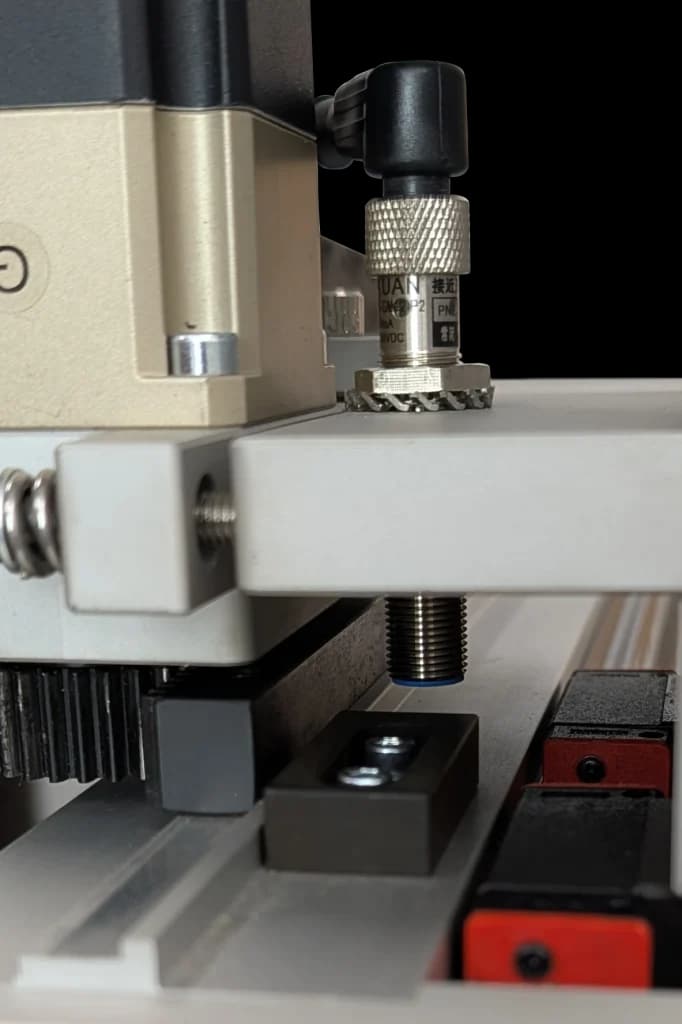Inductive proximity sensor mounted on CNC frame